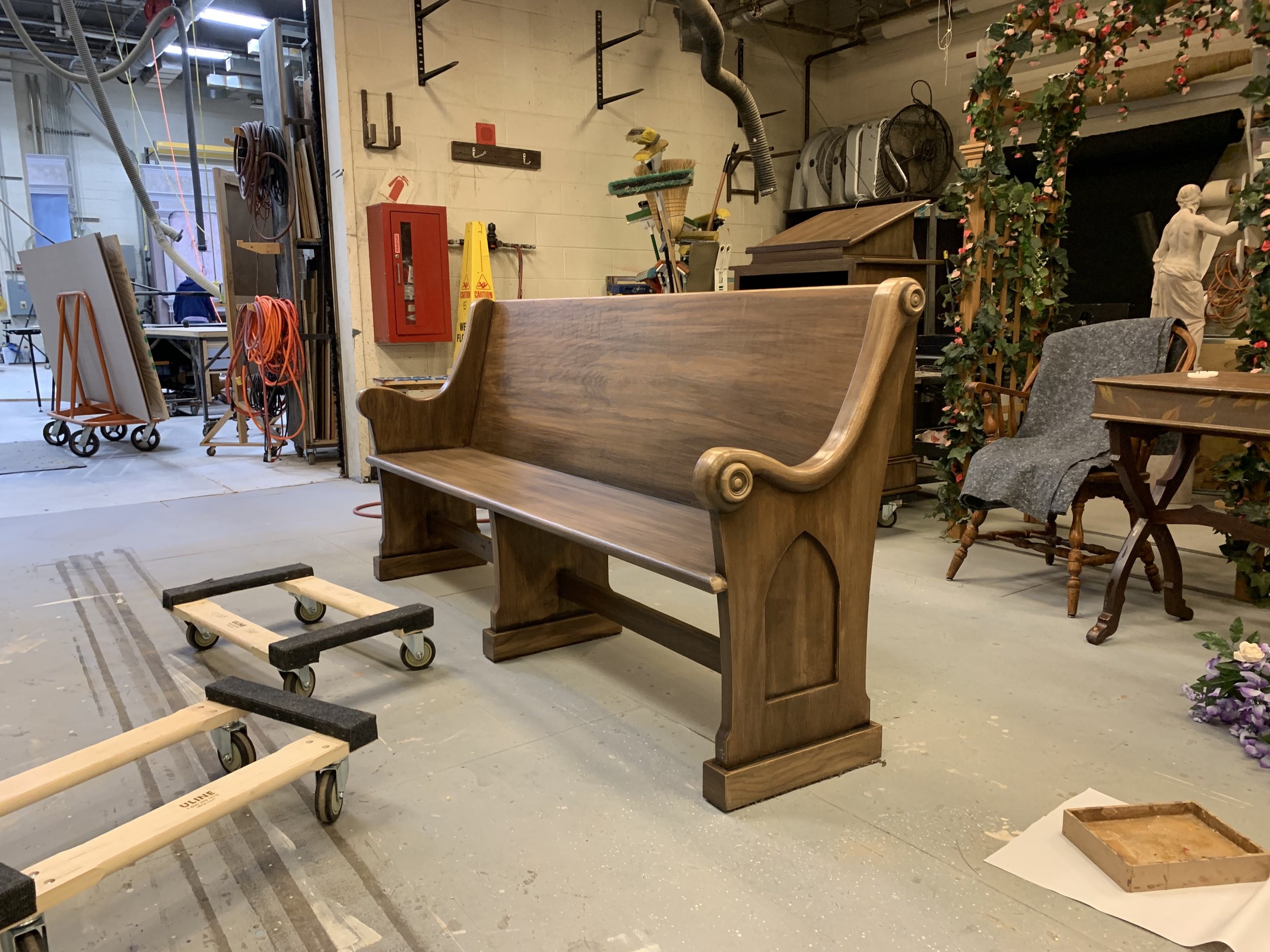 A wooden church pew made for a production of Emma (UMD). Painted by The Clarice paint shop.