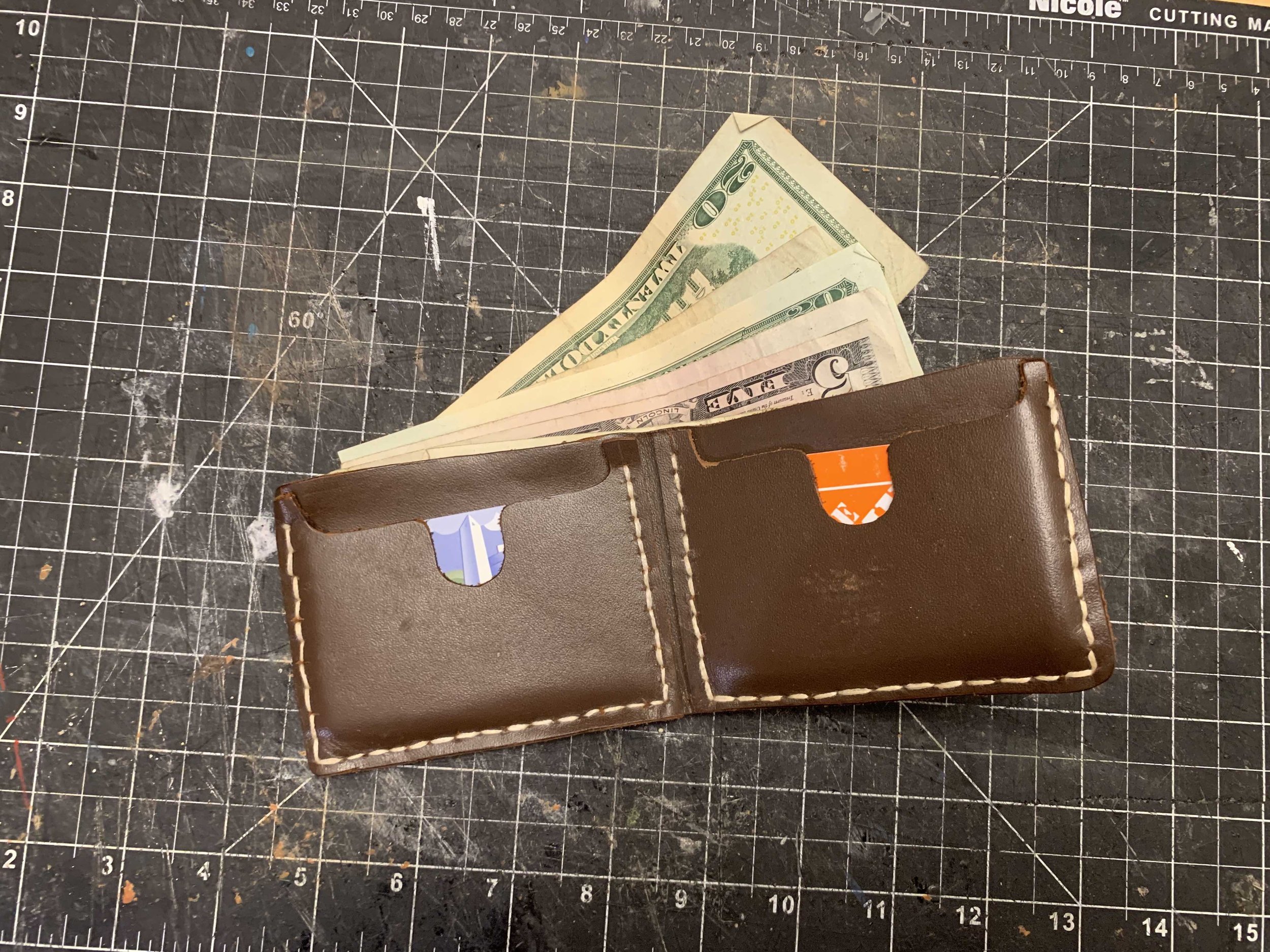 A leather wallet I once made to hold my cards and cash.