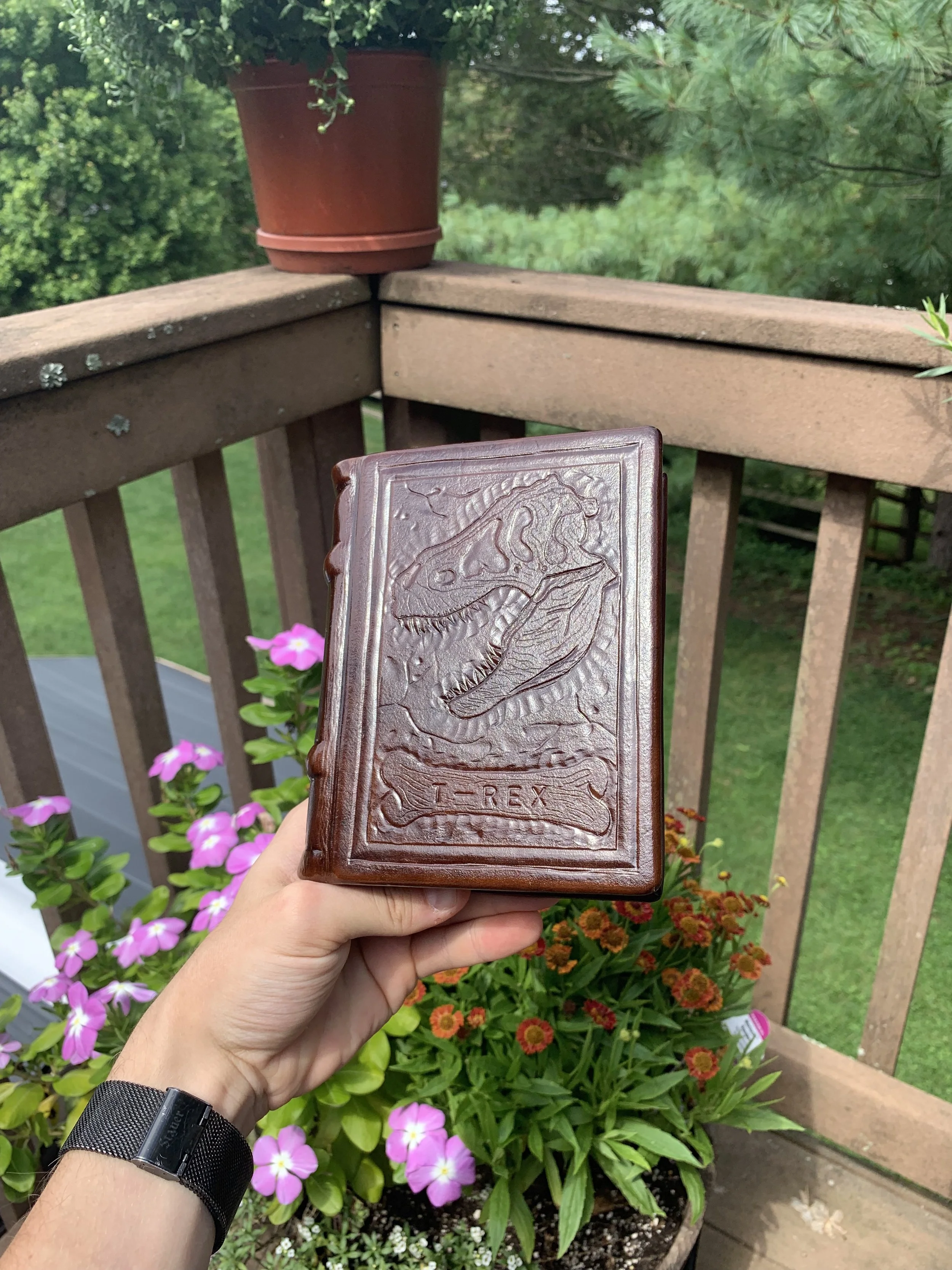 A small T-Rex themed hand bound book made of paper and veg tanned leather. Sold on Etsy