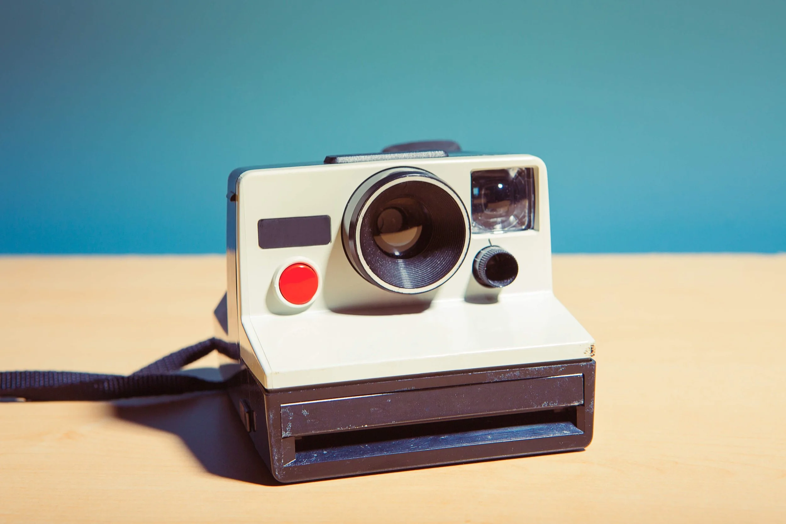 Nostalgic Polaroid camera evoking the memory-making moments of our family-friendly foam party experiences