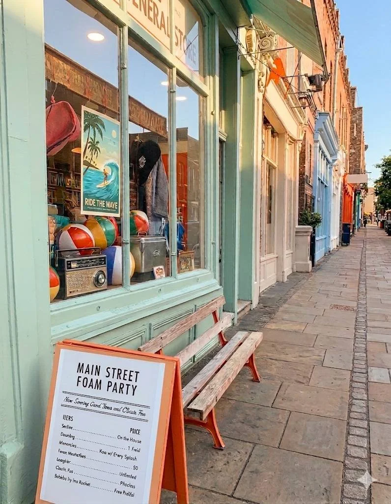 A nostalgic Main Street-inspired storefront display in San Jose featuring a Main Street Foam Party sign and vintage summer decor.