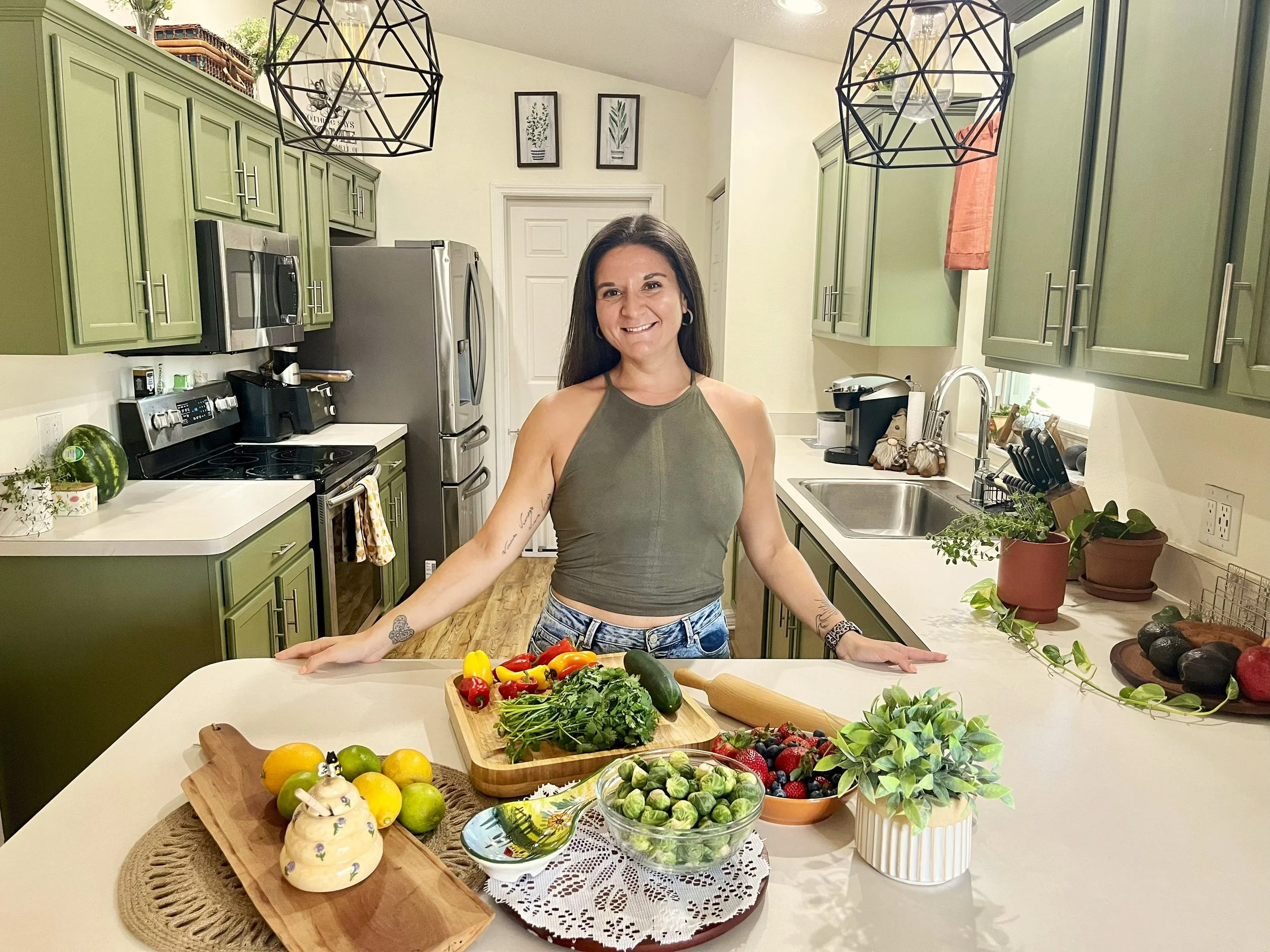 Fit girl in kitchen with healthy meals