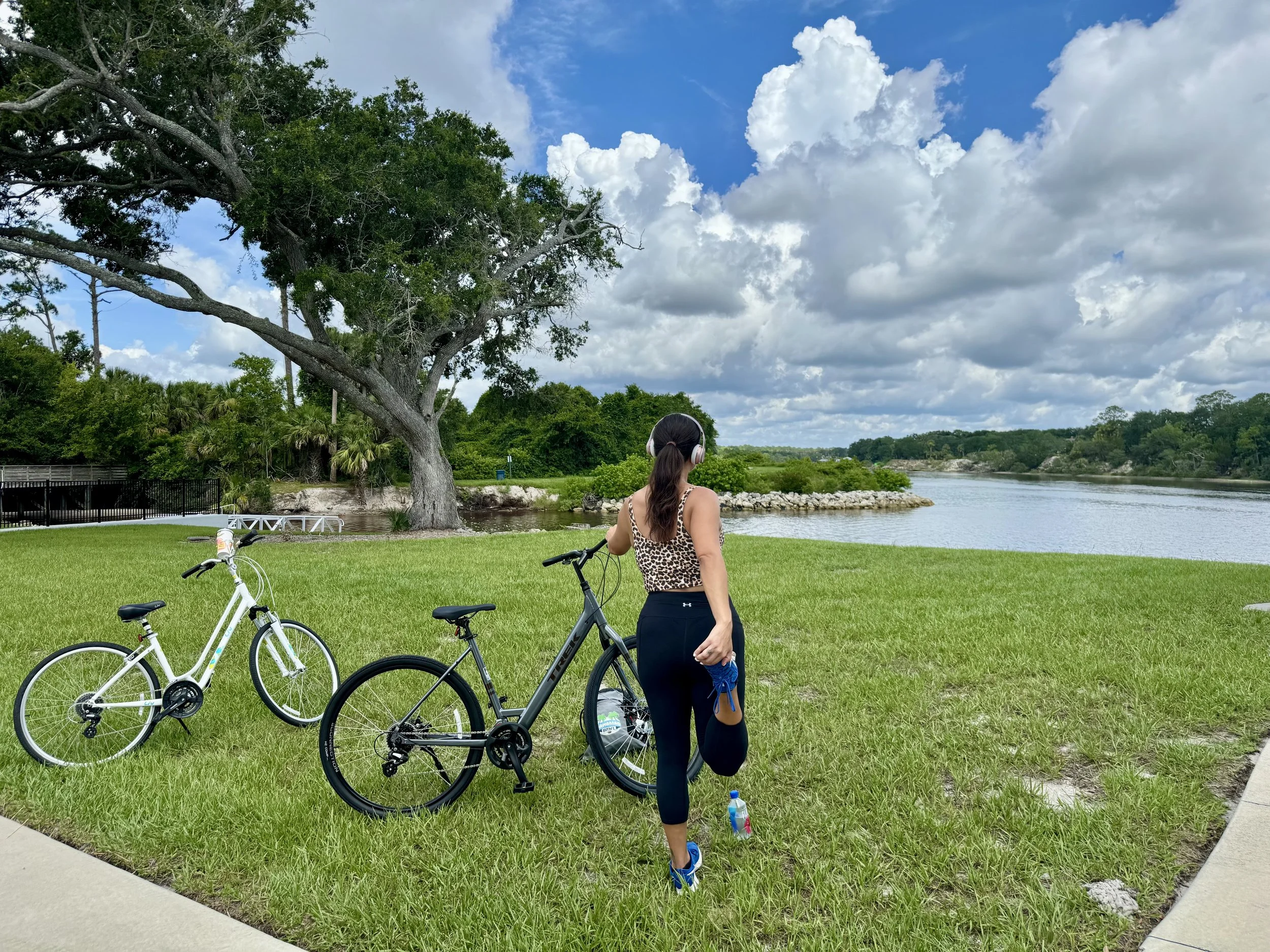 Bike rider stretching in park