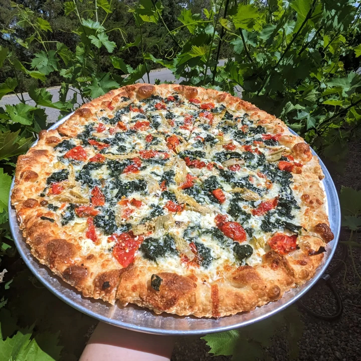 We have a killer special this week, the Florentine! Spinach, sundried tomatoes, artichoke hearts, fresh garlic, goat cheese, and pecorino romano. It's a light summer pie, perfect for the hell on earth we are currently enduring. Hope you all have a gr