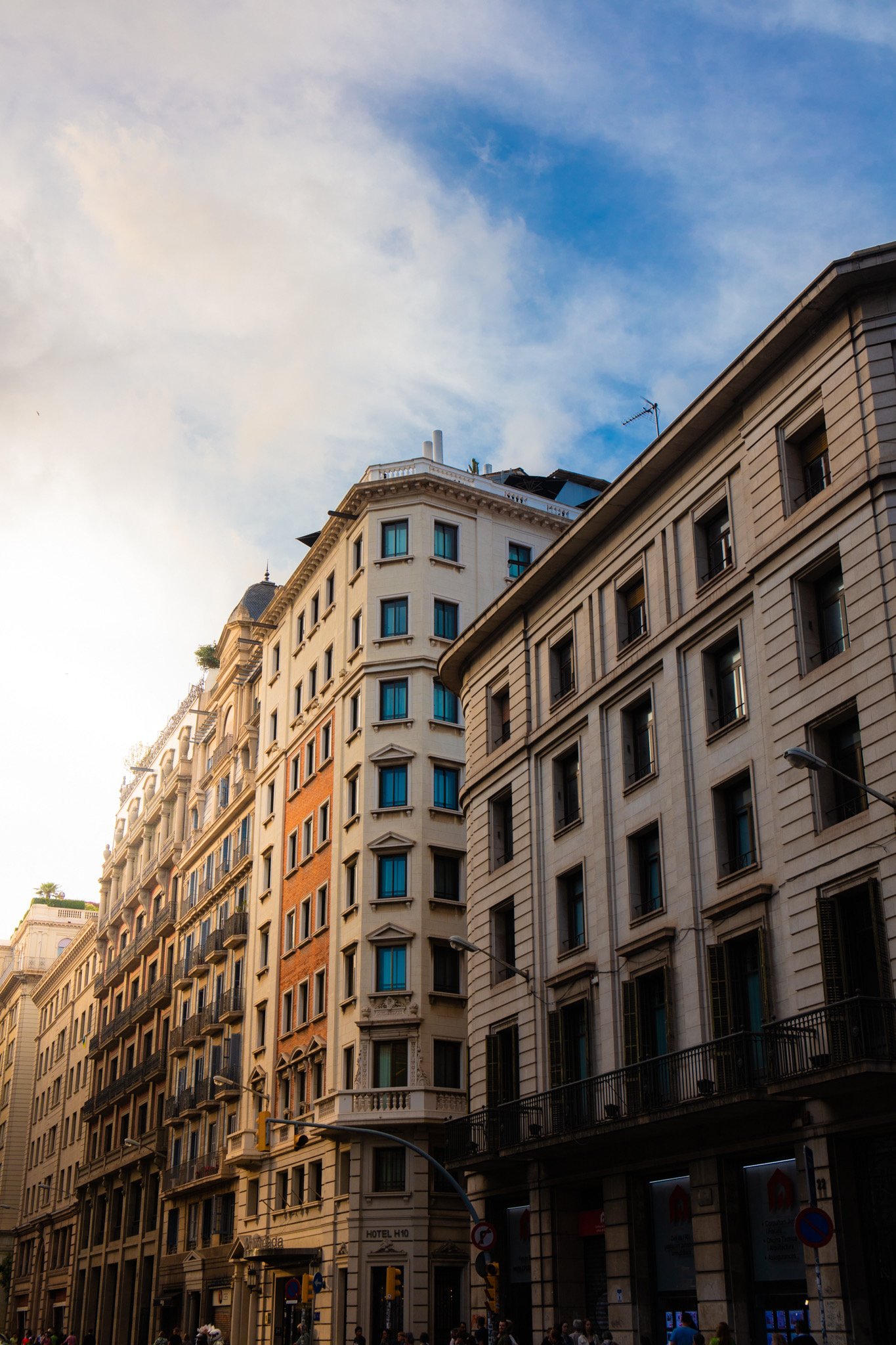Street view of European-style buildings against a blue sky