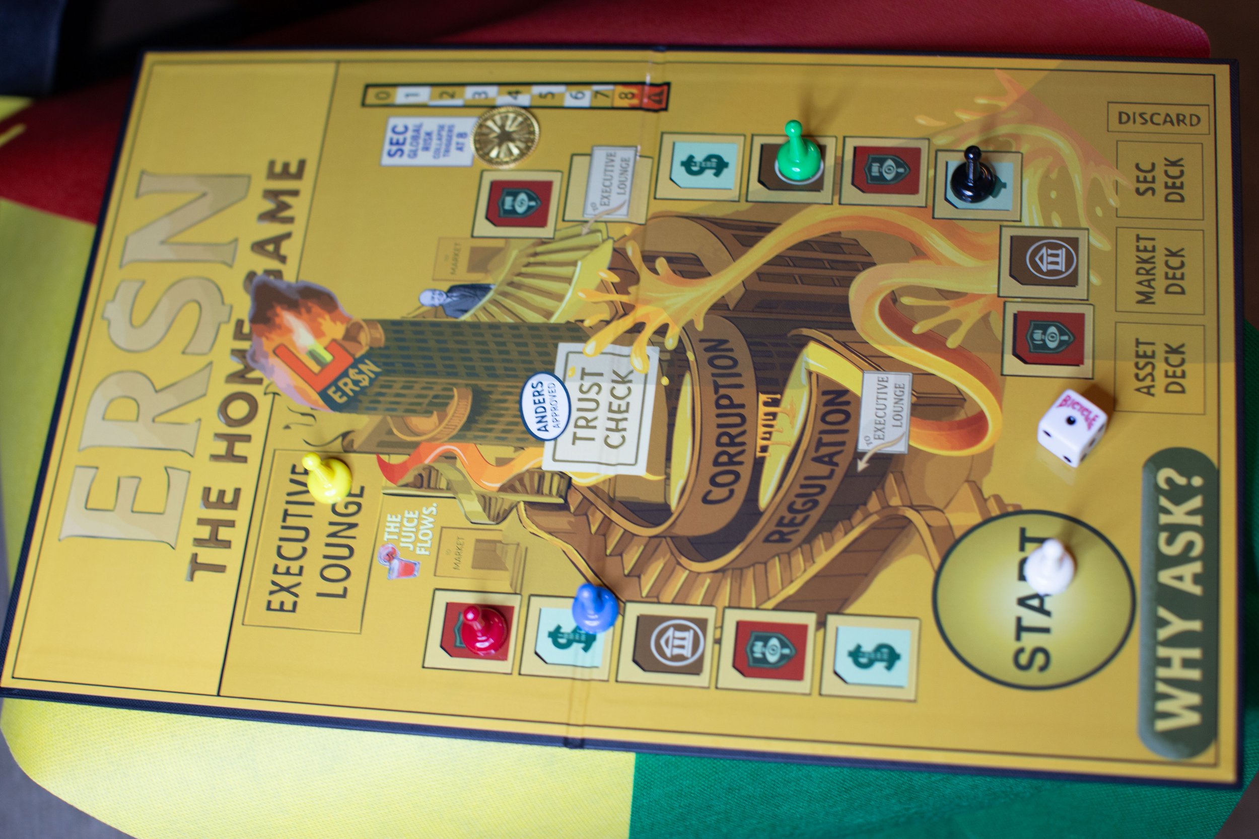 Board game titled 'ERSON THE SHERIFF'S GAME' with colorful pieces, tokens, dice, and various labeled sections on the board.