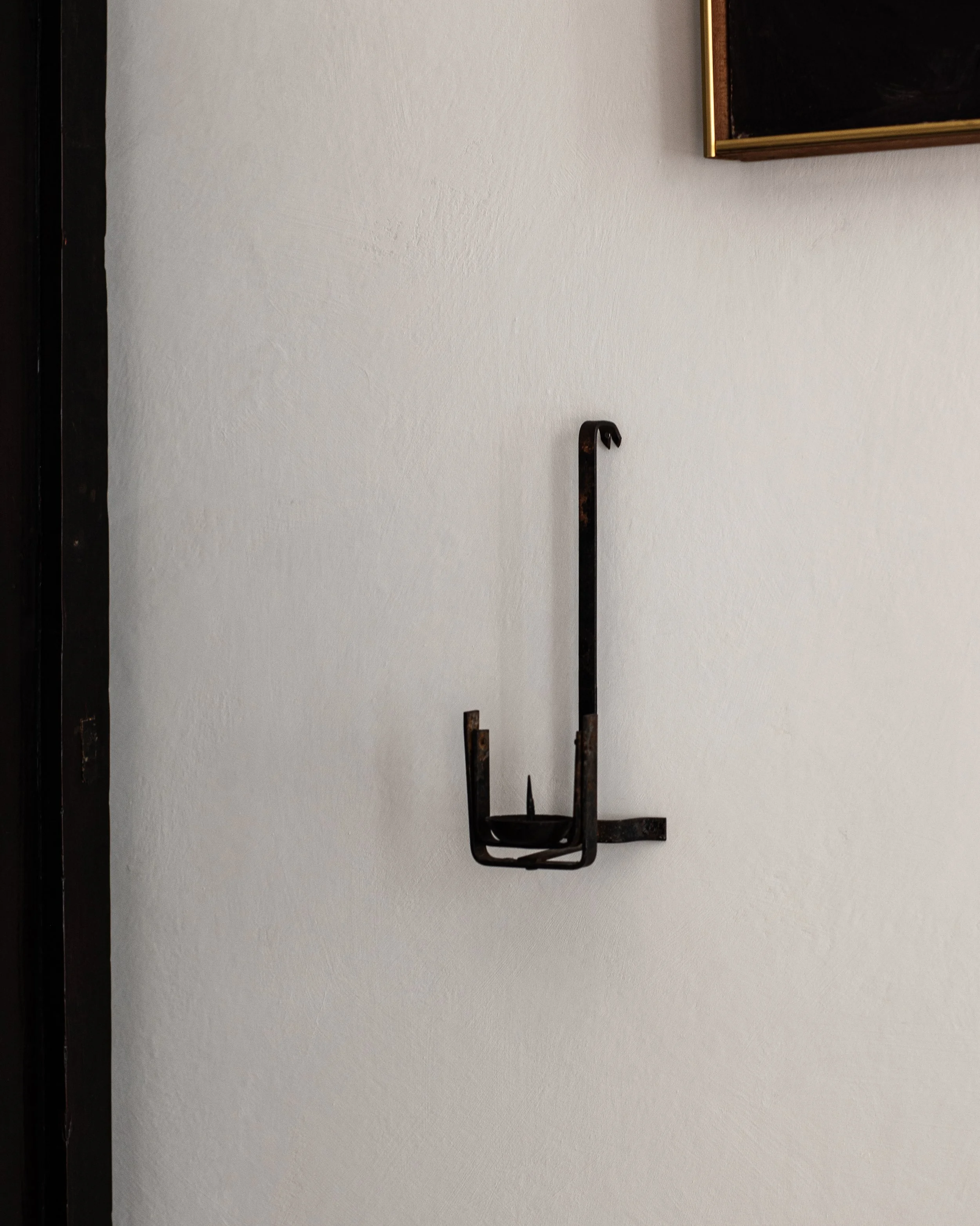 Kura Swivel Iron Candle Holder