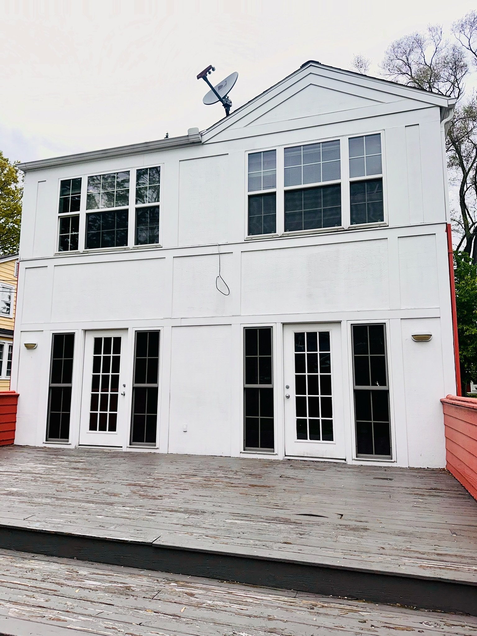 Home with multiple screened window and door openings suitable for custom-fit screen frames