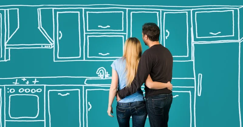Homeowner and contractor reviewing a remodel plan together before construction begins