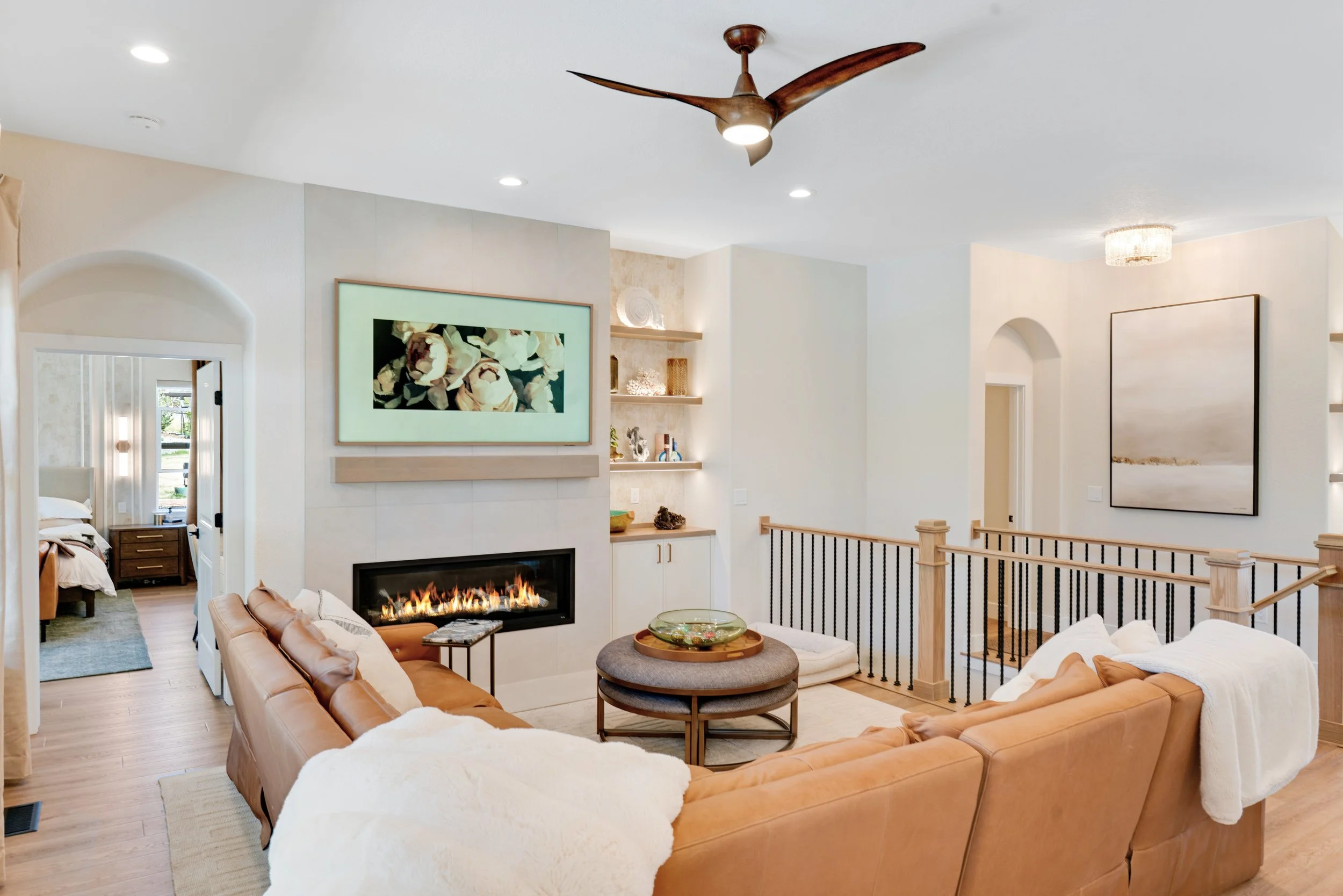 LEATHER SOFA, LIVING ROOM, FIREPLACE, FRAME TV, FLOATING SHELVES, INTERIOR STAGING