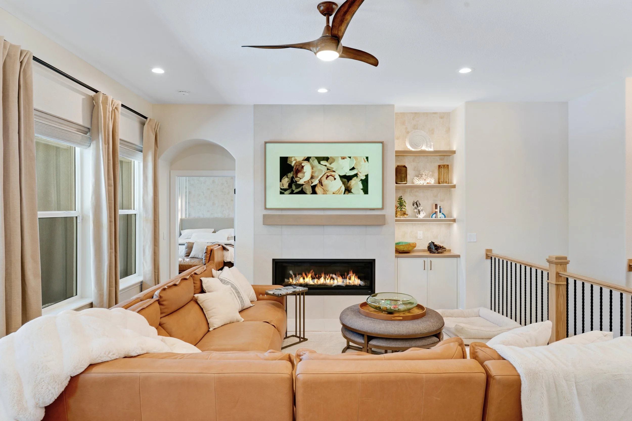 LEATHER SOFA, LIVING ROOM, FIREPLACE, FRAME TV, FLOATING SHELVES, INTERIOR STAGING
