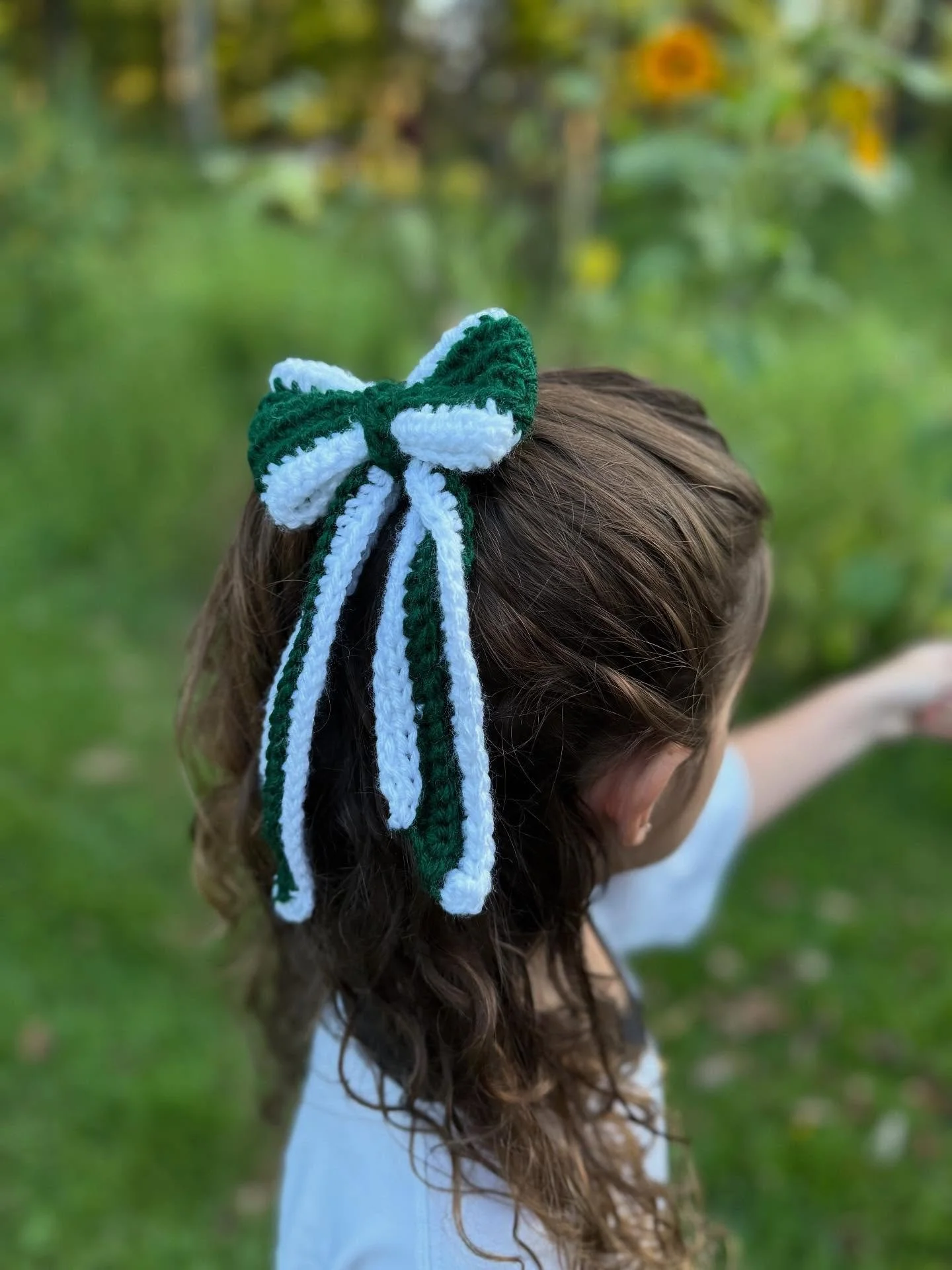 🦅💚 ✨ Hand-stitched spirit for the win! These crocheted bows are the perfect touch to keep your look #GameDayReady 💚🏈