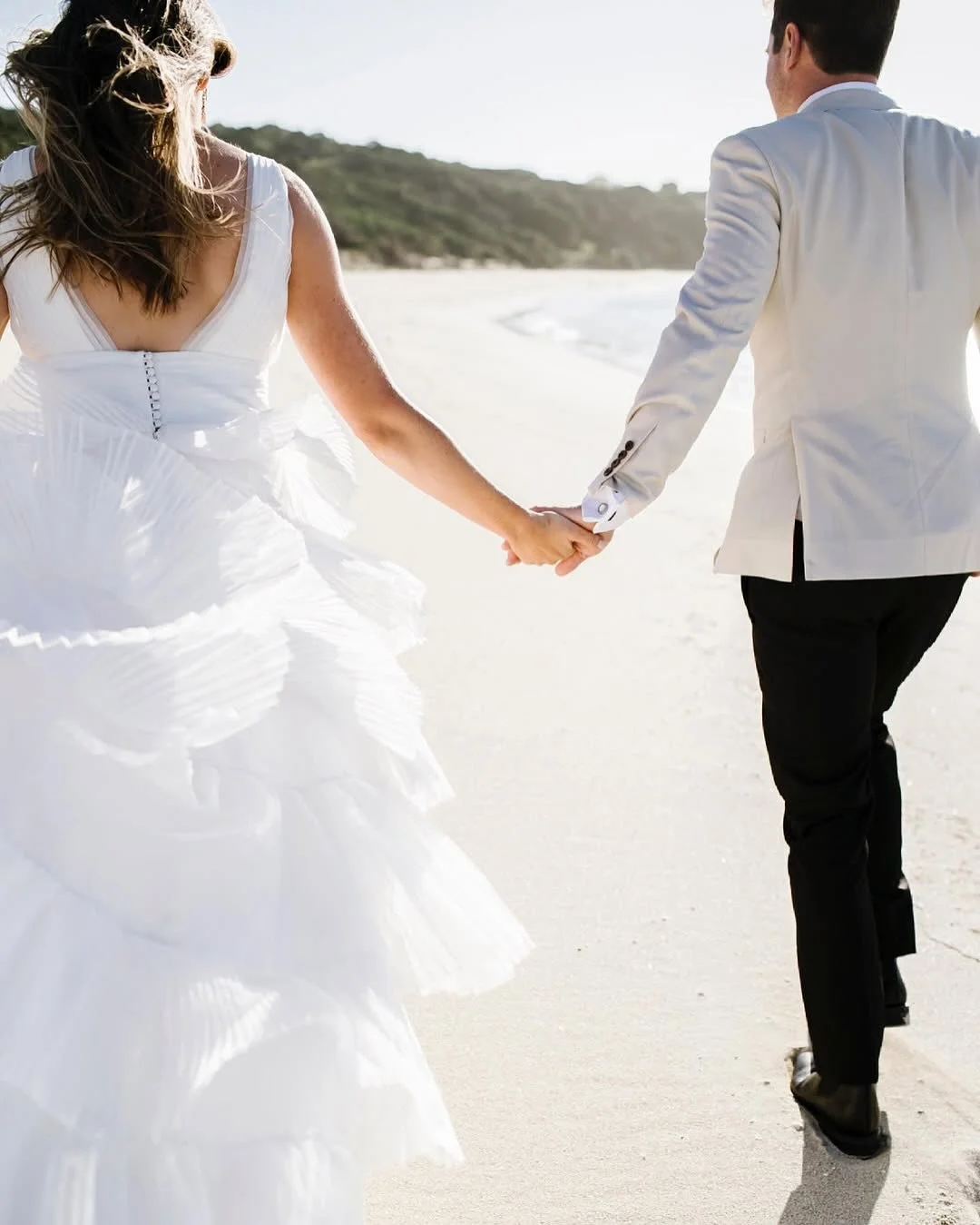 Aimee’s bespoke gown was handcrafted in natural silk organza, featuring individually pleated, graduated layers that created a soft silhouette 🤍
The design was completed with a dramatic deep V neckline and backline, blending elegance with moder