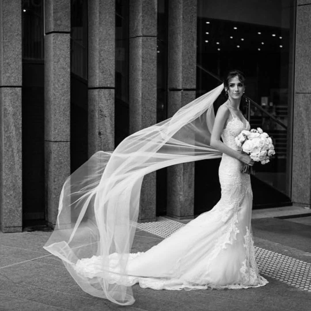 Morgan’s custom couture gown was designed to celebrate her graceful silhouette, with intricate lace detailing and a timeless mermaid silhouette. 
The soft, sweeping veil adds a dramatic, ethereal finish 🩶🖤
Handcrafted in our Subiaco studio,
