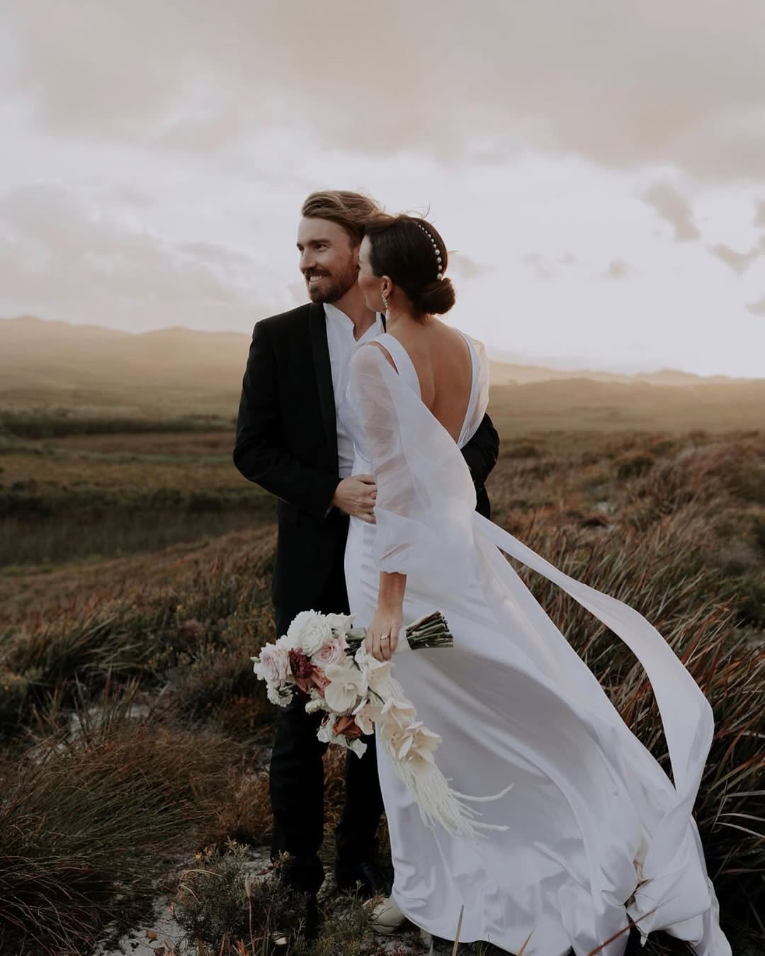 Brooke wears a gown inspired by her own vision &mdash; a beautiful collaboration brought to life ✨

This custom shift design features an elegant empire line in luxurious heavy silk satin, flowing into a chapel-length train. 
The deep V neckline and b