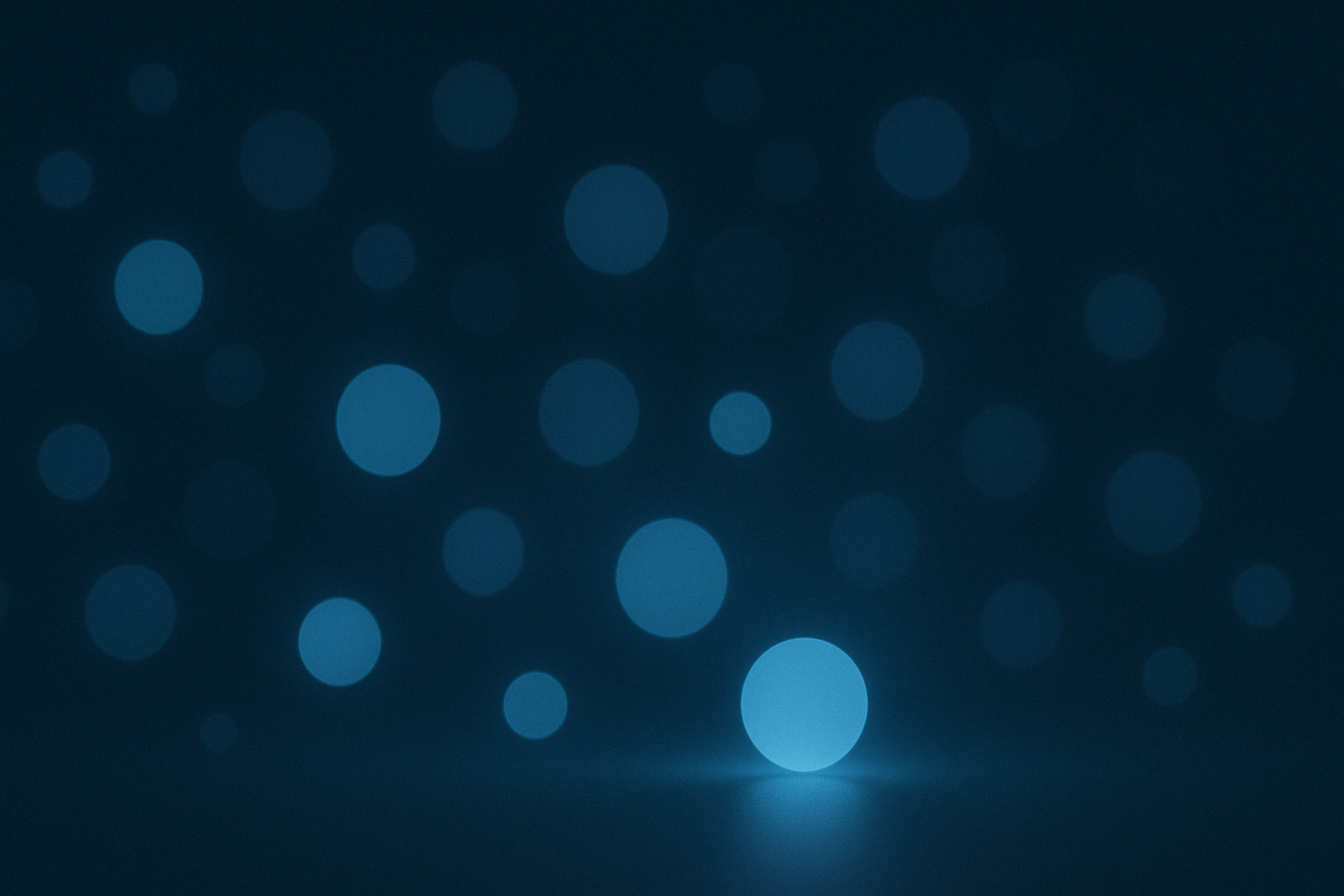 Glowing blue circles of varying sizes on a dark background.