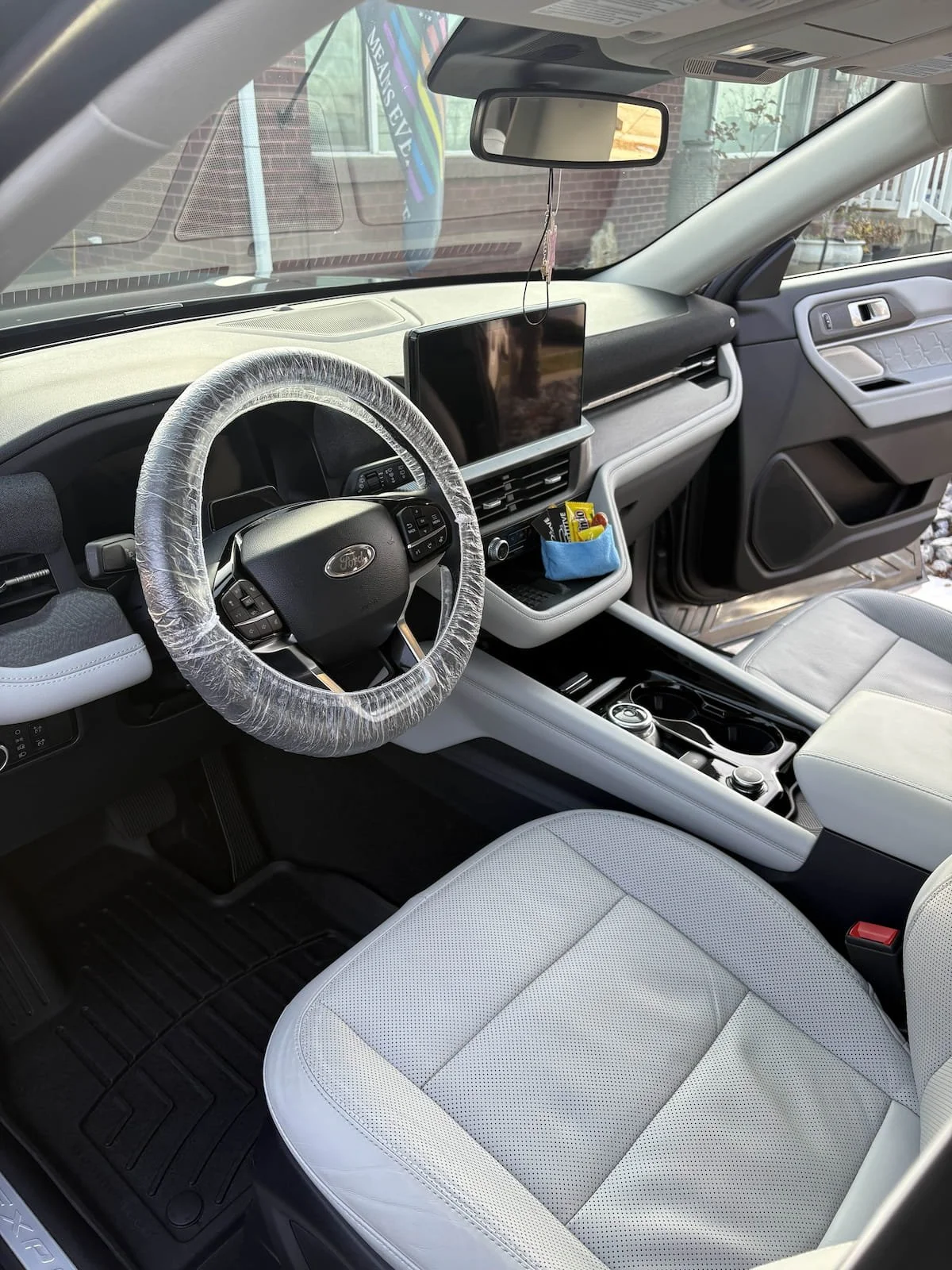 Detailed car interior with cleaned vents, console, and seats