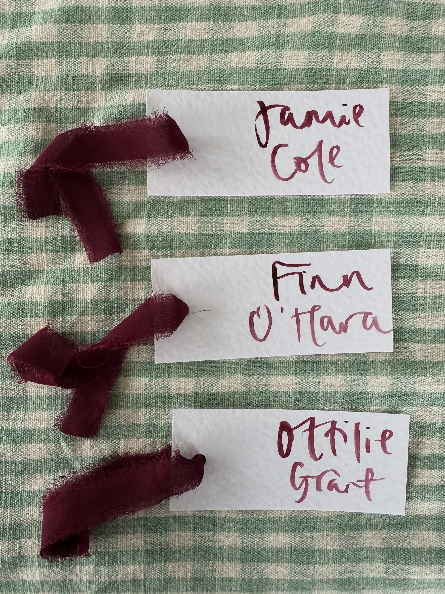 Deep burgundy name places with chiffon ribbons. For a styled shoot with @georgiabarbaraevents &amp; @emmaphoenixflowers ❤️