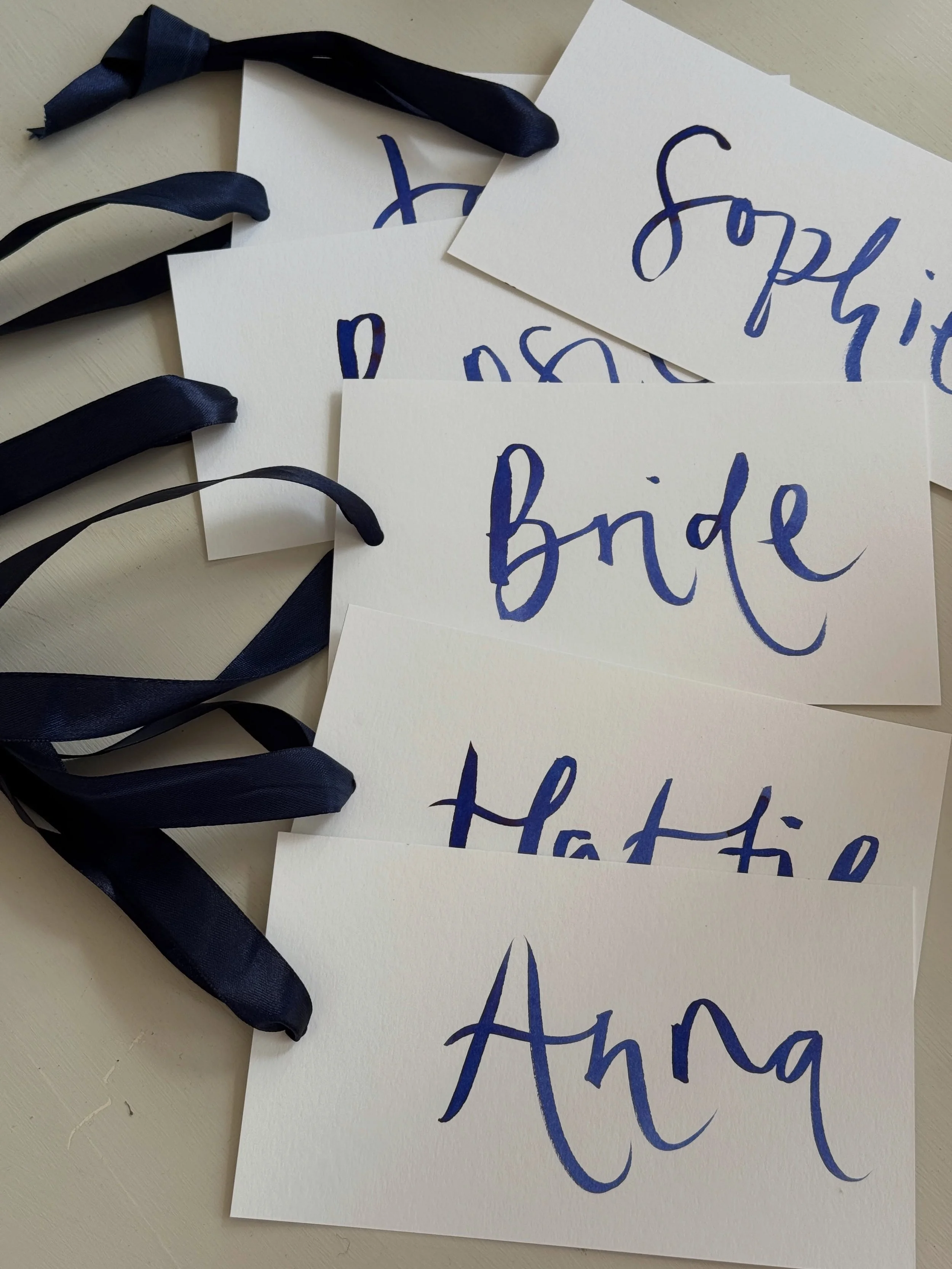 Hand painted bridesmaid dress tags, name places and thank you cards for Megan and Johnnie 💙
.
.
.
.
.
#weddingstationery #funwedding #modernwedding #calligraphy #blue