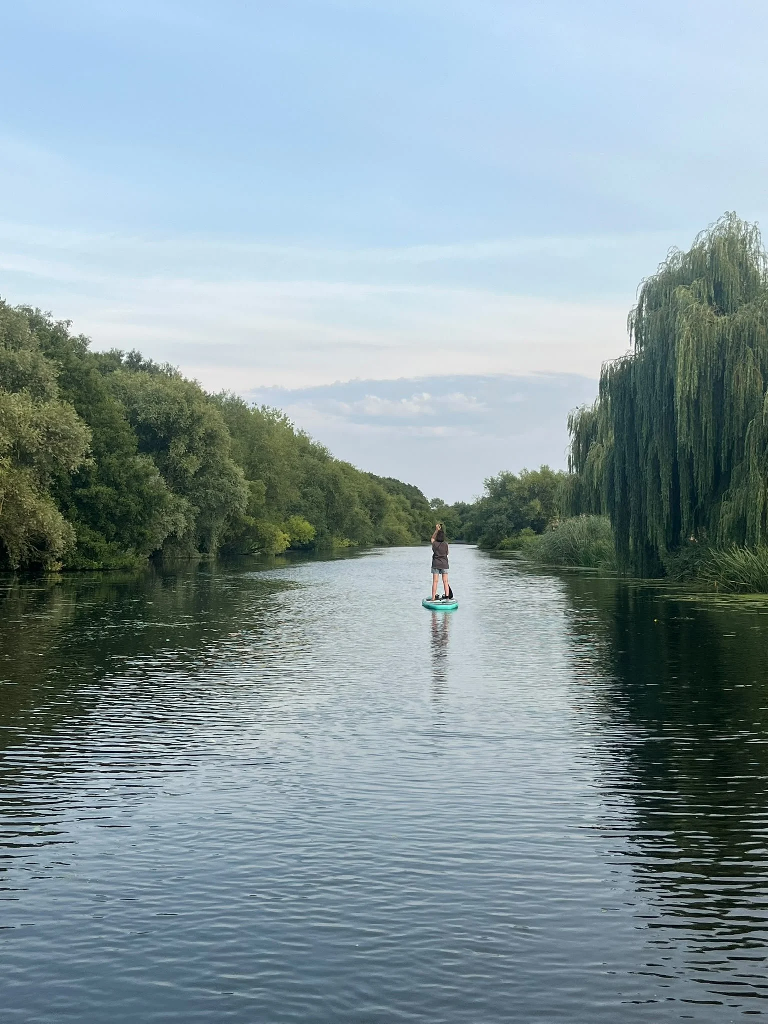 stand-up paddleboarding on a river