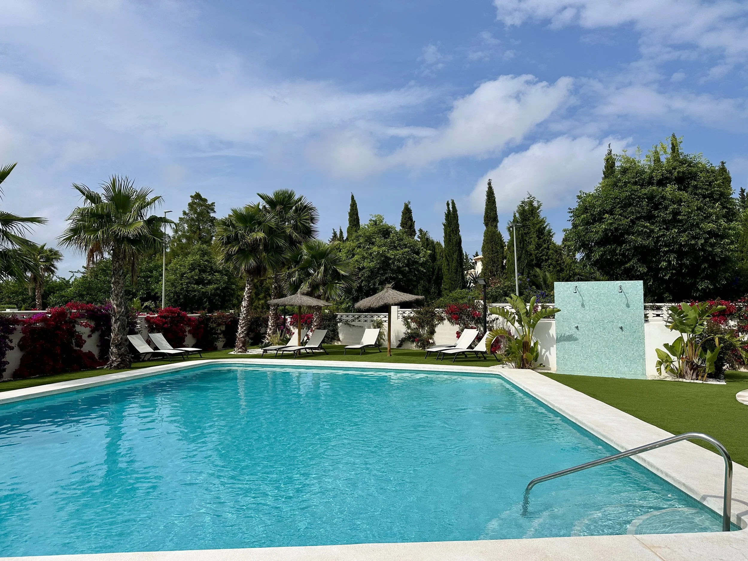 Panorama Penthouse 10 La Siesta community poolside offers a tranquil escape.