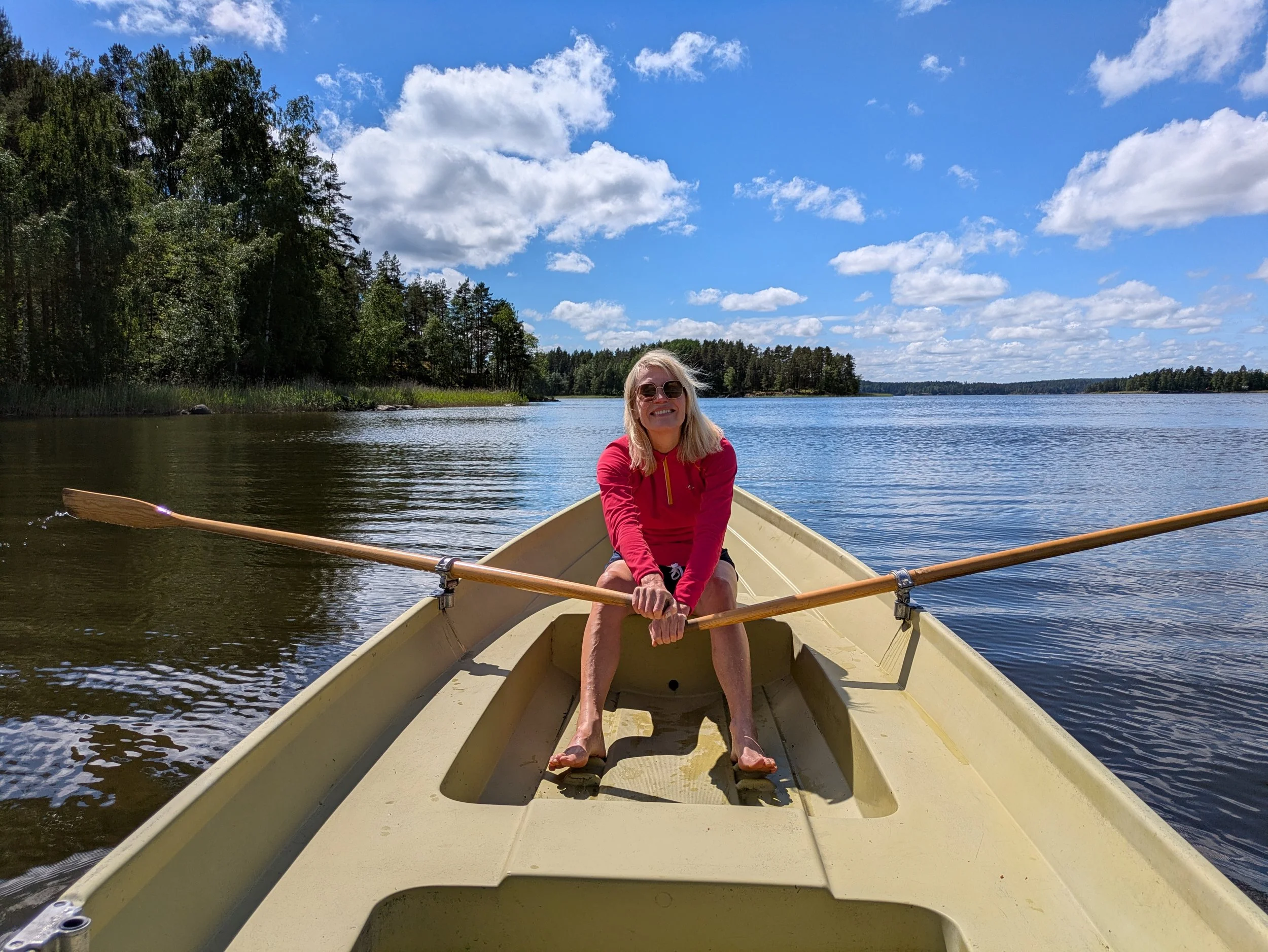 A traditional rowing boat is moored at the private shore of Blueberry Villa on Lake Saimaa, ready for peaceful trips across the lake to enjoy the surrounding nature and quiet Finnish Lakeland.