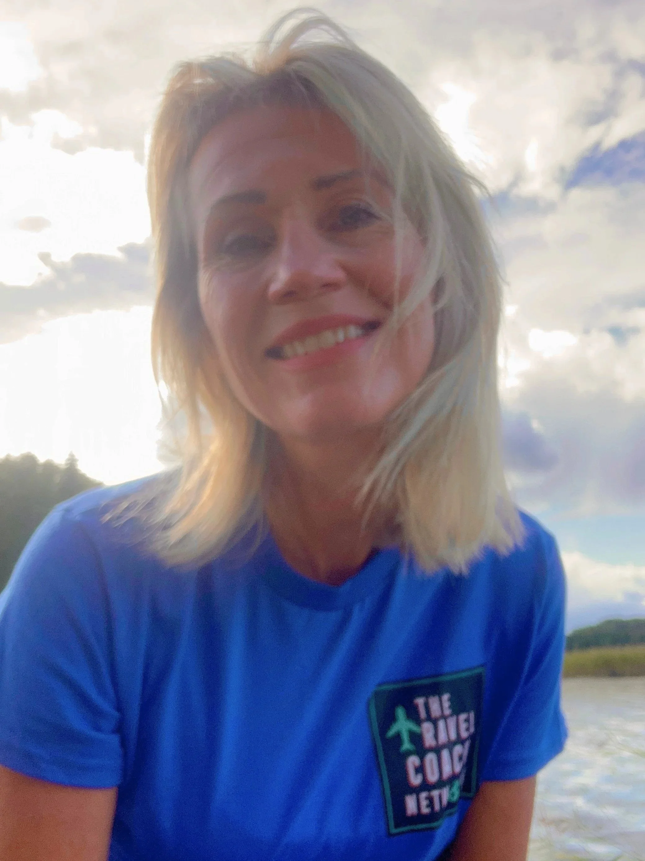 Mirka Kristiina a certified travel coach at her Blueberry villa pier in Finland.