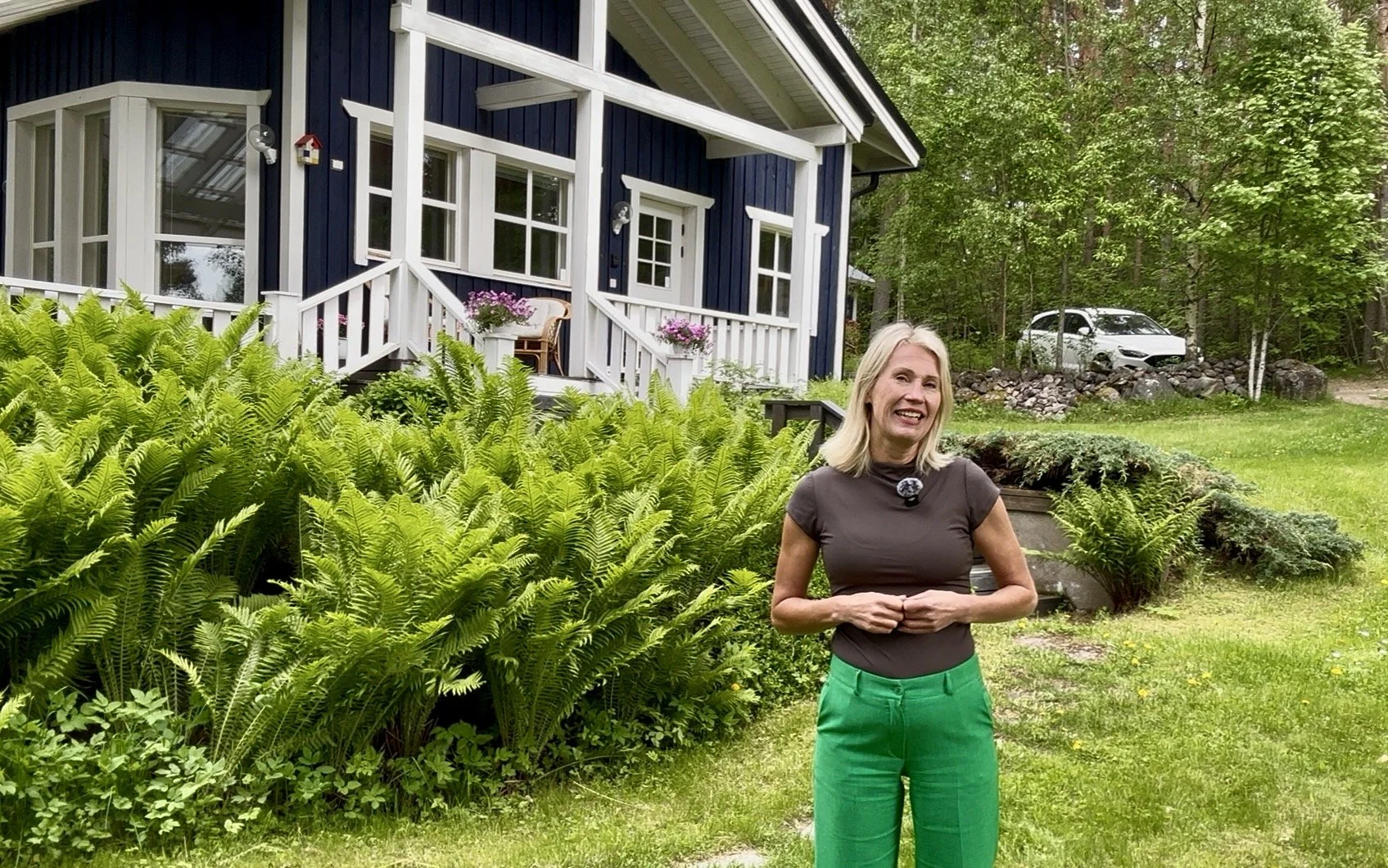 Founder Mirka Kristiina Bruun at Blueberry Villa on Lake Saimaa, Finland, presenting The Journey Studio, Finnish Happiness Camp experiences, and slow travel retreats.