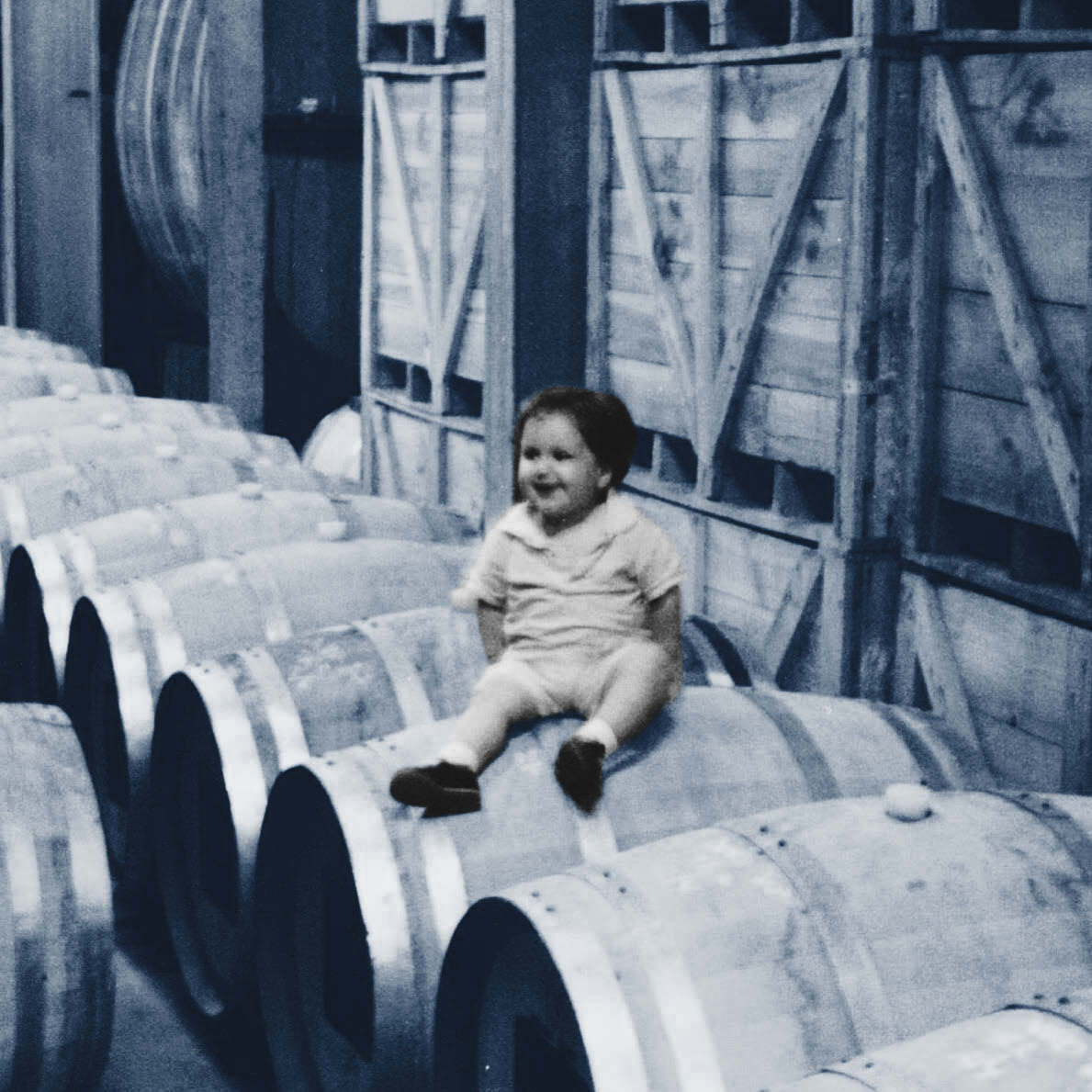Elliot AWIN SITTING ON A BARREL IN A CELLAR