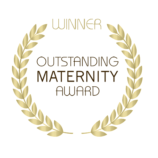 A circular award badge with a gold laurel wreath border, congratulating the winner of the Outstanding Maternity Award.