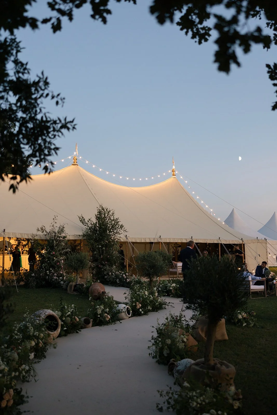 sail-and-peg-luxury-sussex-sailcloth-flying-lights-marquee-garden-entrance-dusk-lights.jpg