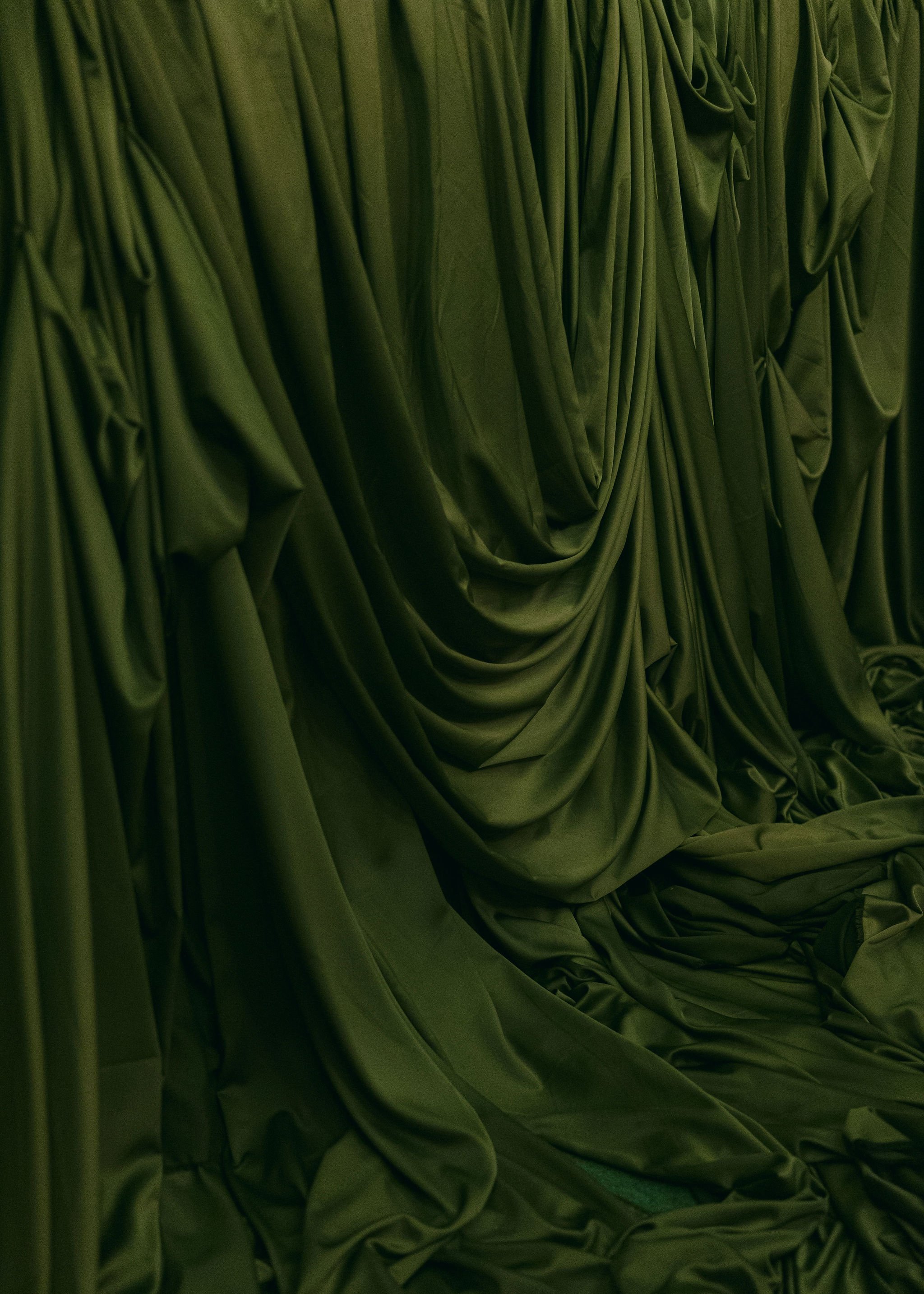 sail-and-peg-draped-green-silk-marquee-interior-texture-luxury-event-design.jpg