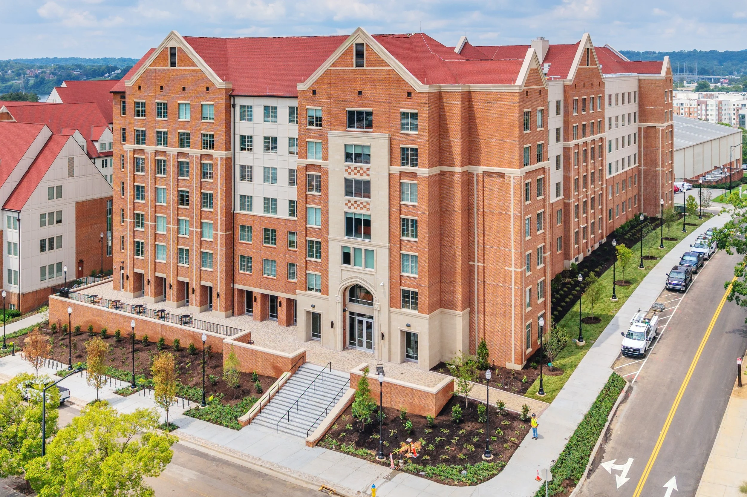 Wet cast and dry cast elements including an arched entry surround and decorative inlays at UT's Andy Holt Residence Hall. A 2026 Cast Stone Excellence Awards entry.
