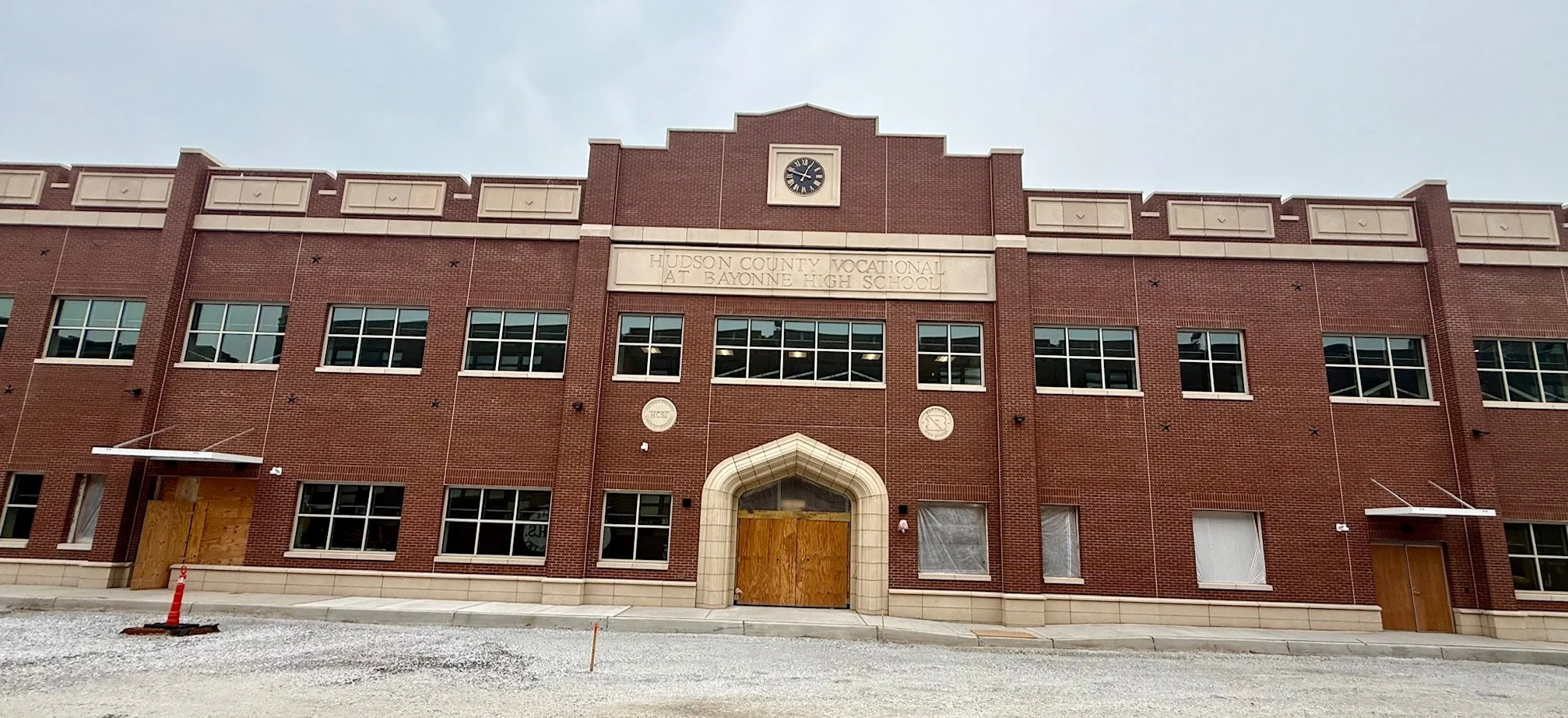 Over 10,000 hand tooled, bush hammered cast stone units and 350 custom molds at Hudson County Vocational High School. A 2026 Cast Stone Excellence Awards entry.