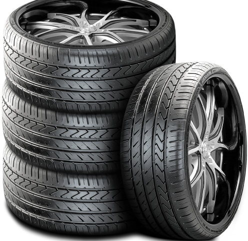 Stack of four black car tires with silver alloy rims on a white background.
