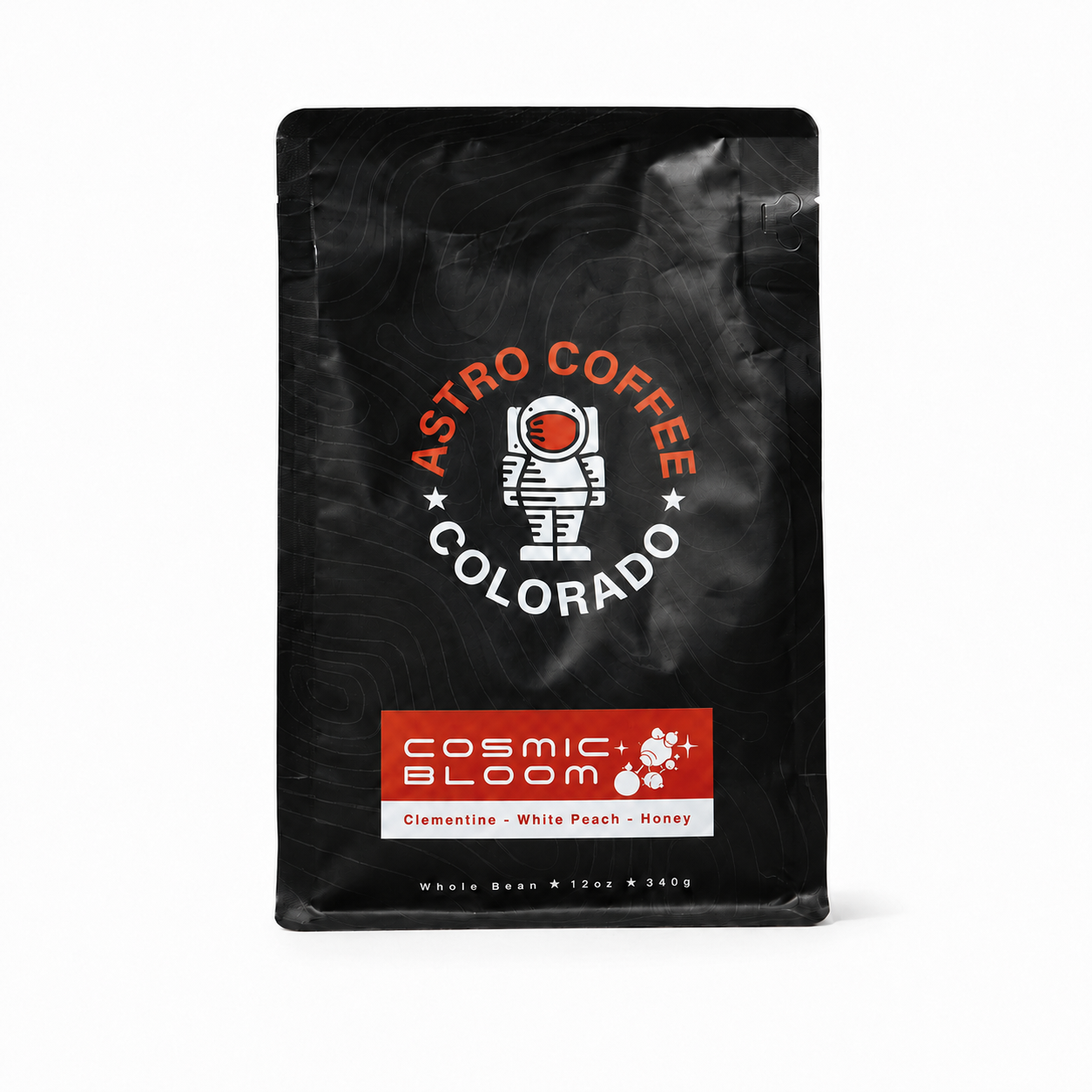 Black coffee bag with logo of an astronaut: Astro Coffee Colorado, flavor Cosmic Bloom pink with clementine, white peach, honey listed on label.