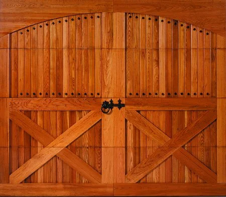 Wooden garage door with vertical panels and decorative hardware