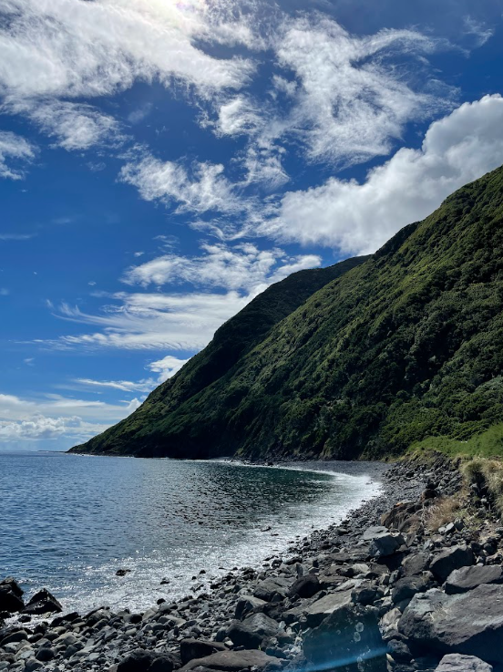 Green cliffs rising above the Atlantic Ocean on São Jorge island, Azores