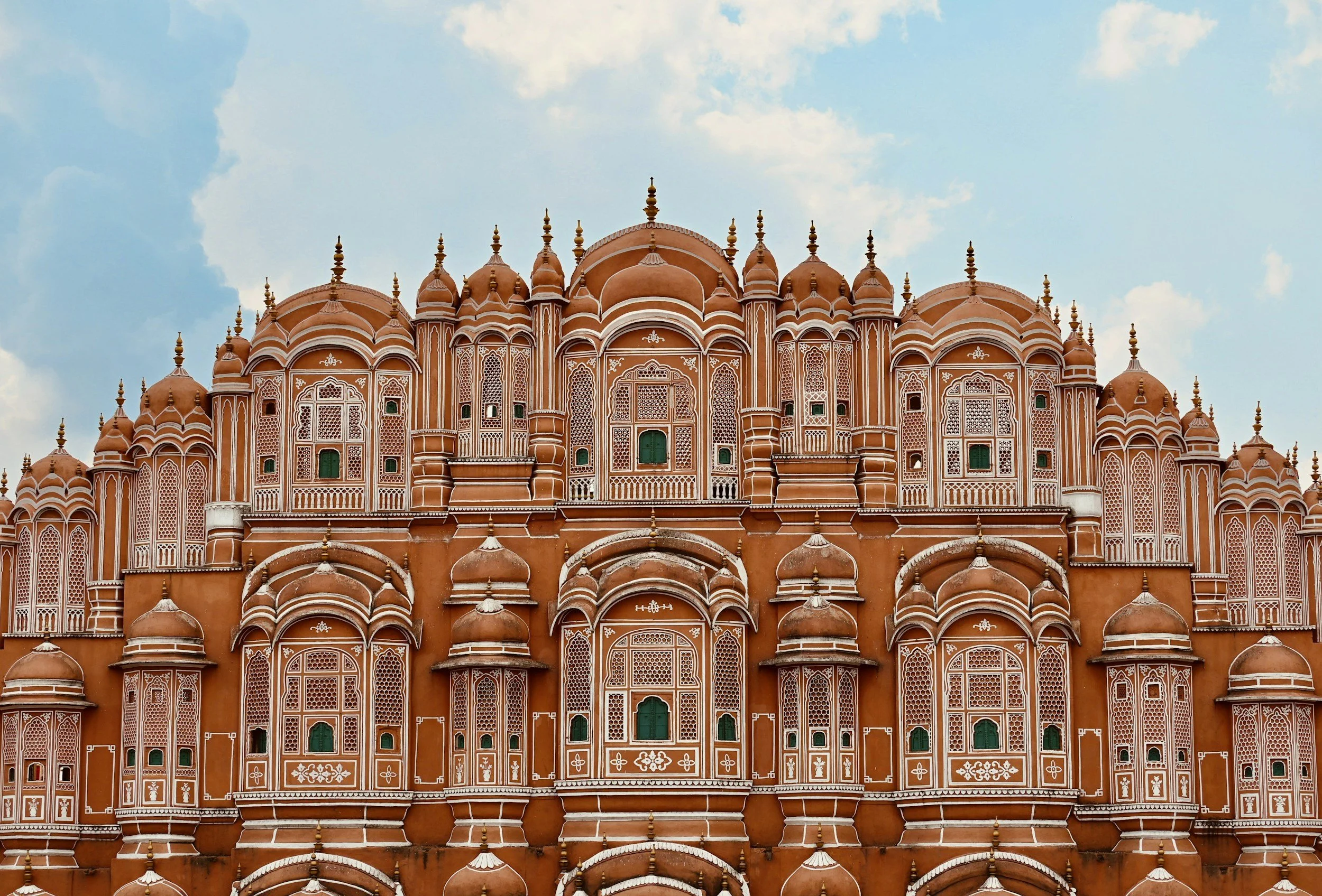 The pink sandstone facade of the Hawa Mahal in Jaipur.