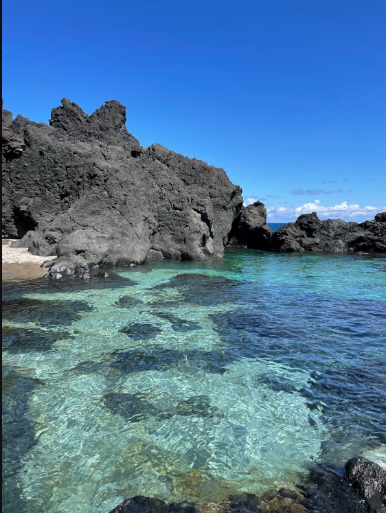 Natural volcanic rock pool with clear turquoise water in the Azores
