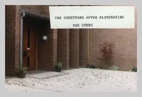 a photo of the main entry door with a caption that reads "the courtyard after eliminating the steps"