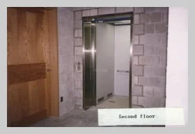 a photo of the open elevator taken from the hallway outside of Gilbert Hall. a caption reads "second floor"