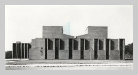 a black and white photo of the exterior street-view of the building