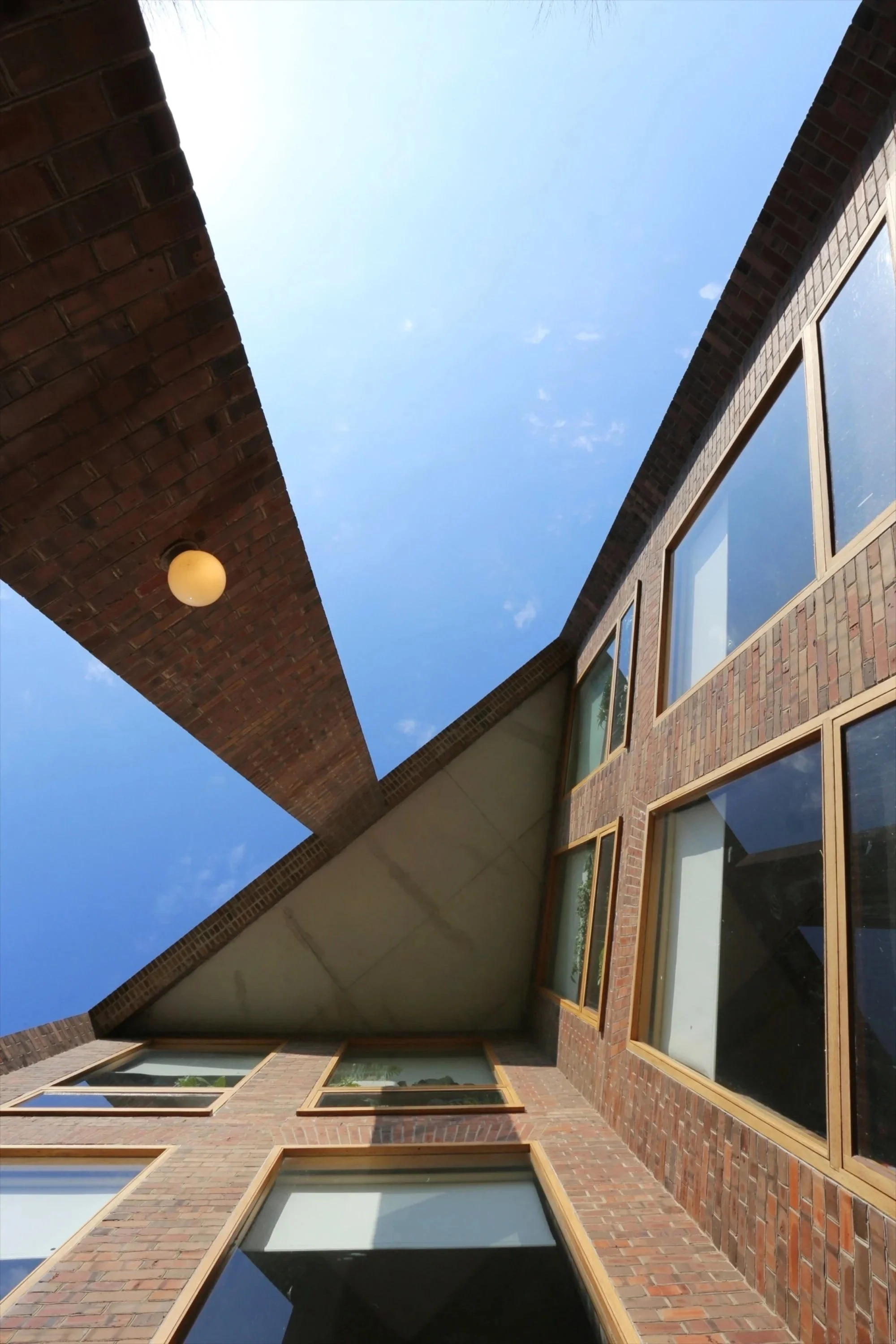 an exterior photo of the building windows showcasing the angles of the building.