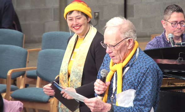 An older congregant shares his testimonial during Sunday Worship