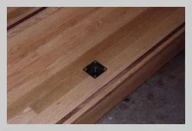 a photo showcasing the railing-mounting hardware on the chancel steps