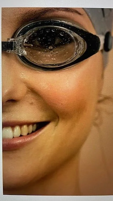 Adult beginner learning front crawl during private swimming lesson Central London