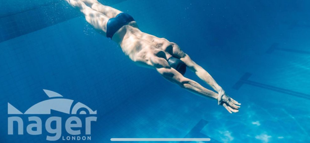 Adult beginner learning front crawl in swimming lesson