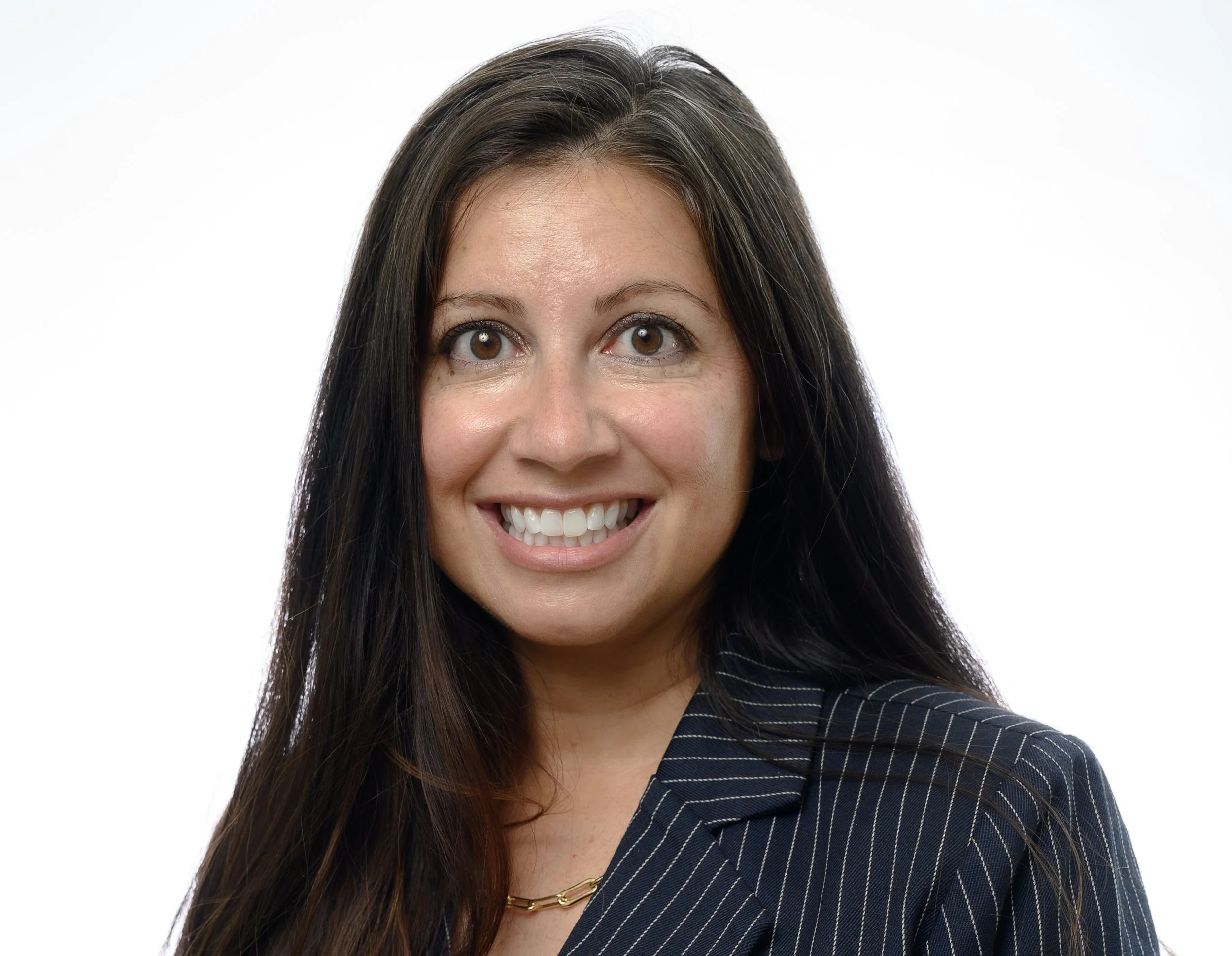 From above hands of unrecognizable woman rubbing aromatic spices into piece of raw meat over parchment paper