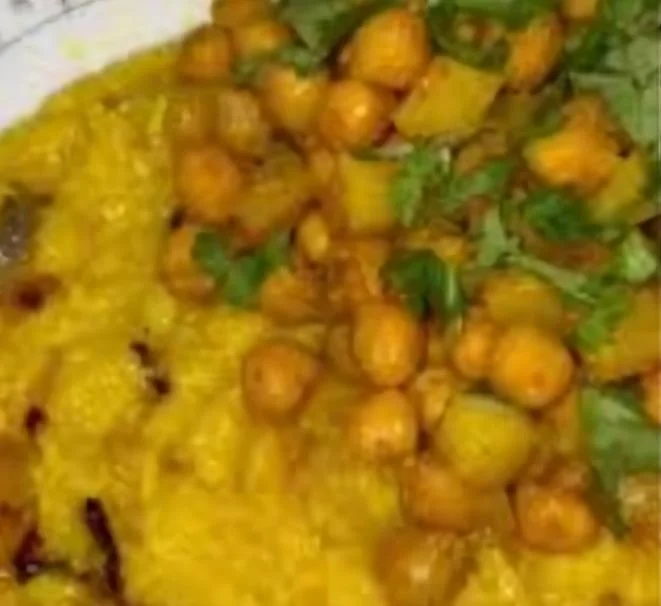 Plate of chickpea curry with turmeric rice